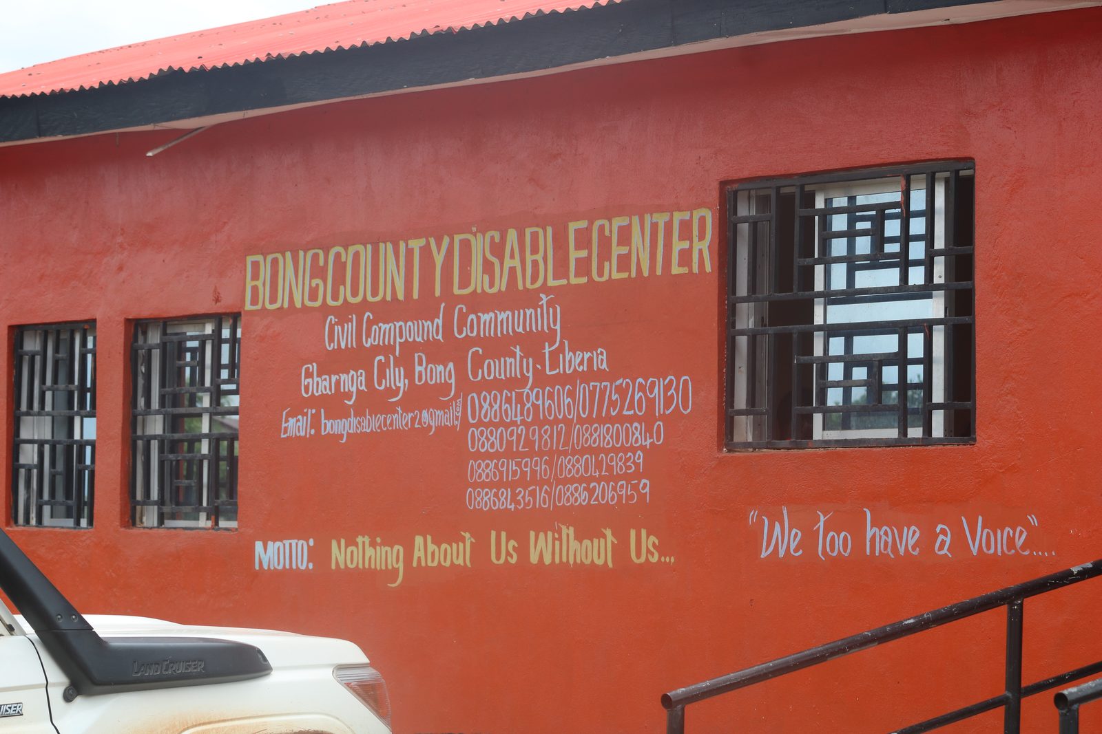 The Bong County Disabled Center in Gbarnga, Bong County, its wall painted with the motto 'Nothing About Us Without Us'.